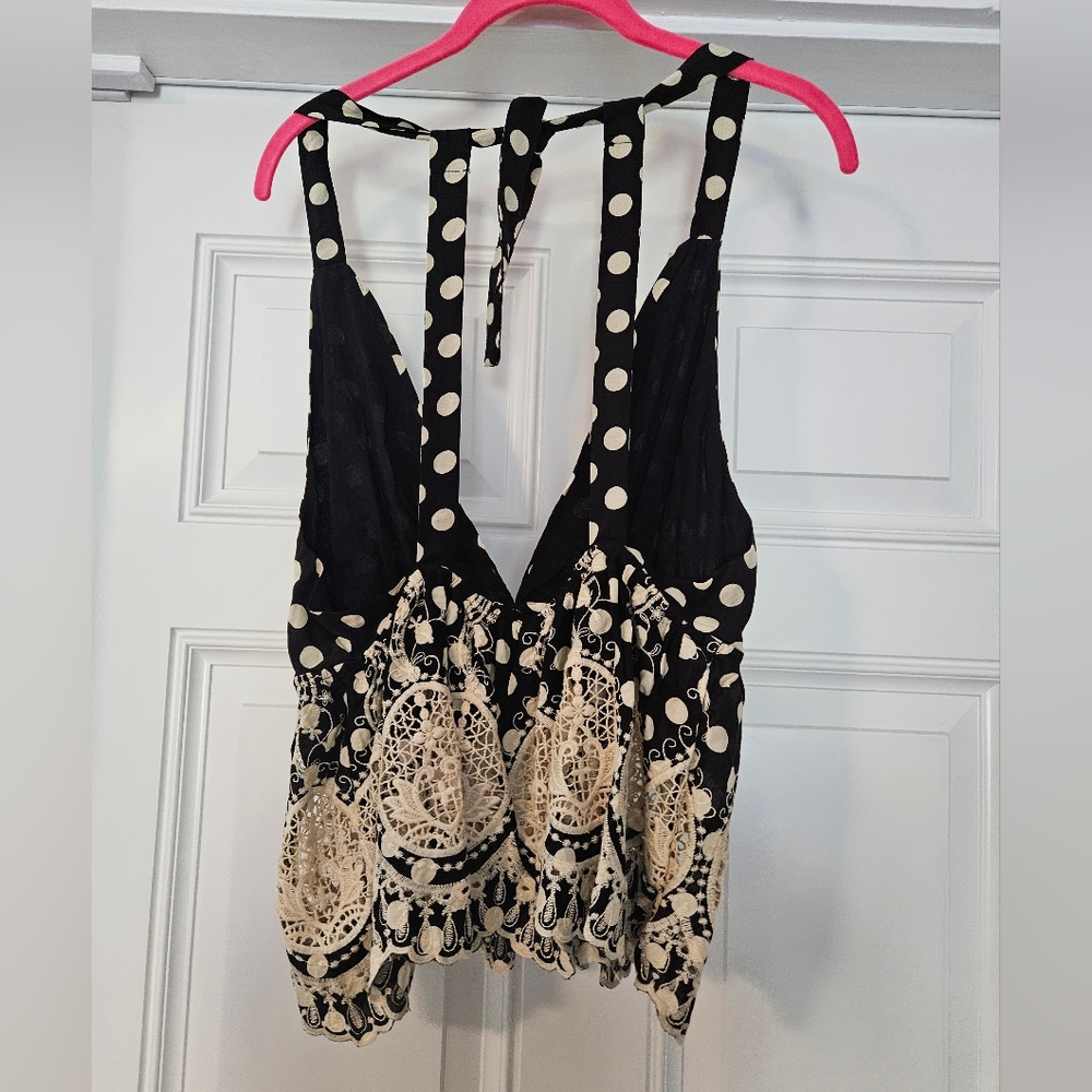 Free people top size XS. Black w cream Polkadots.          A - Picture 3 of 6